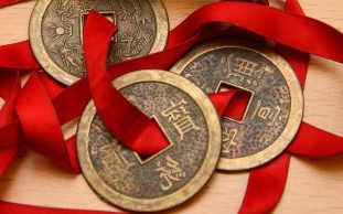 Chinese coins tied with a red ribbon